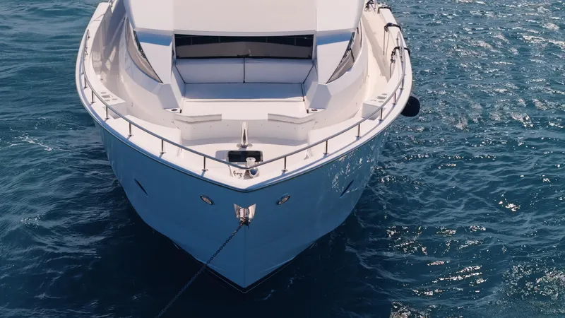  Yacht Photos Pics Front view of 2017 Hatteras M75 Panacera yacht on blue ocean water.