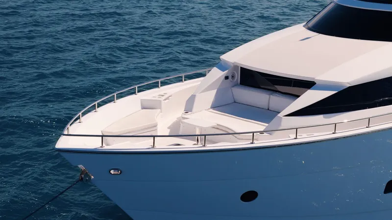  Yacht Photos Pics 2017 Hatteras M75 Panacera yacht on calm blue ocean waters.