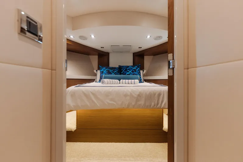  Yacht Photos Pics Luxurious bedroom interior of 2017 Hatteras M75 Panacera yacht with elegant bedding.