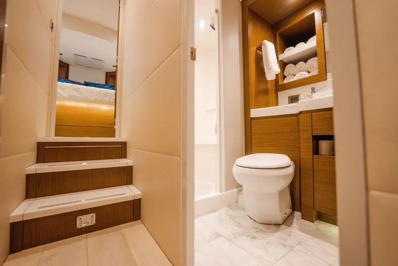  Yacht Photos Pics Luxurious bathroom and stairs in 2017 Hatteras M75 Panacera yacht interior.