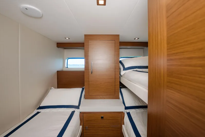  Yacht Photos Pics 2017 Hatteras M75 Panacera cabin with twin beds and wooden cabinetry.
