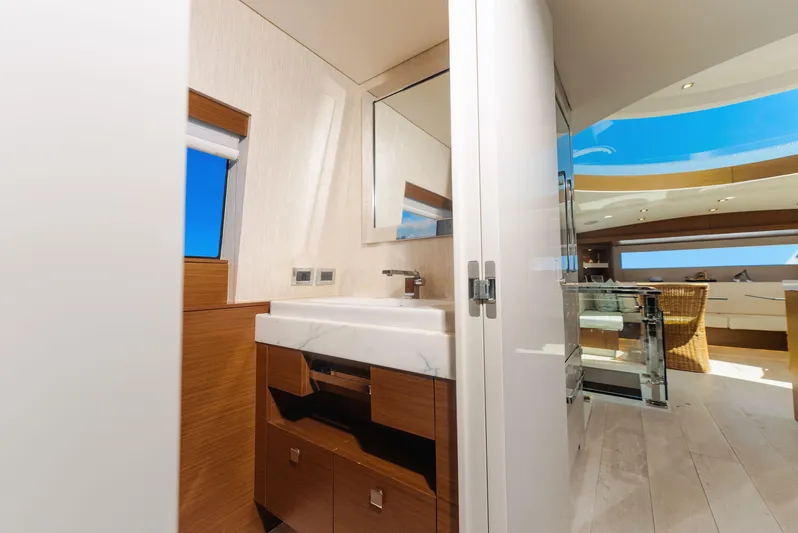  Yacht Photos Pics Luxurious bathroom interior on 2017 Hatteras M75 Panacera yacht, featuring modern design and ocean view.