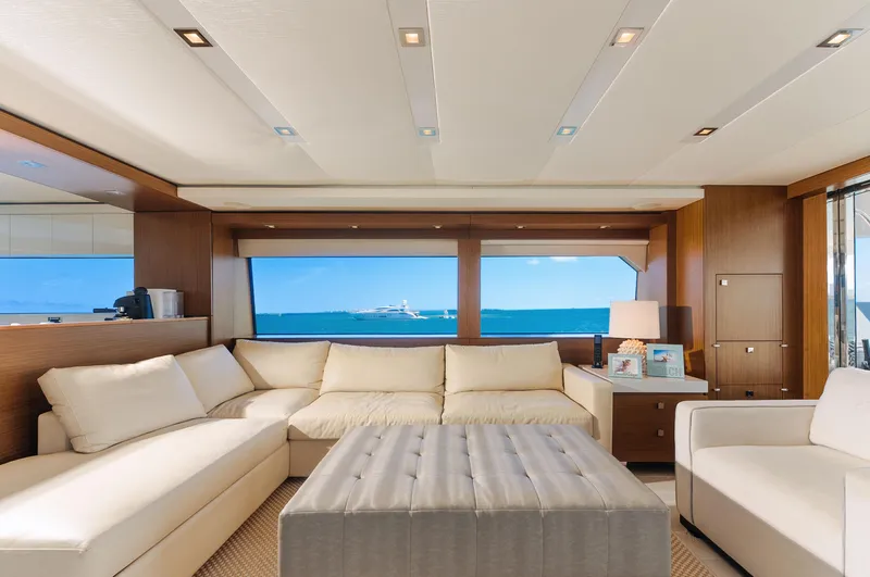  Yacht Photos Pics Luxurious interior of 2017 Hatteras M75 Panacera yacht with ocean view through large windows.