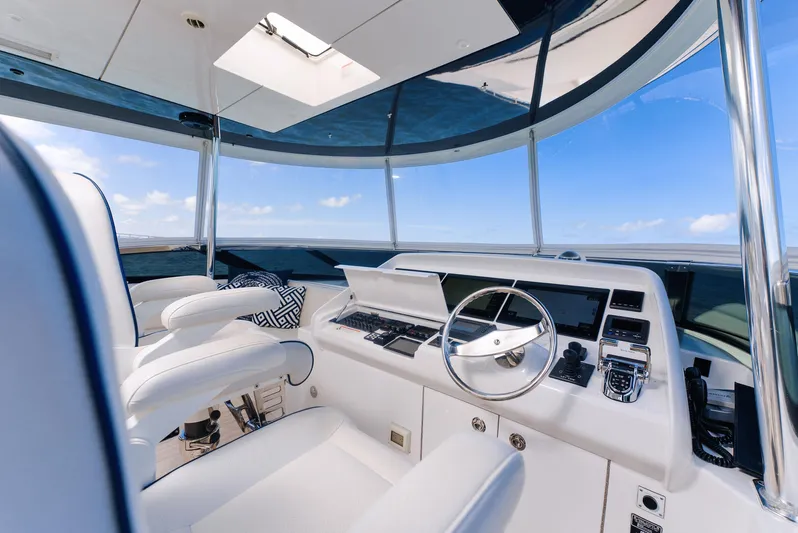  Yacht Photos Pics Luxurious helm of 2017 Hatteras M75 Panacera yacht with modern controls and panoramic view.