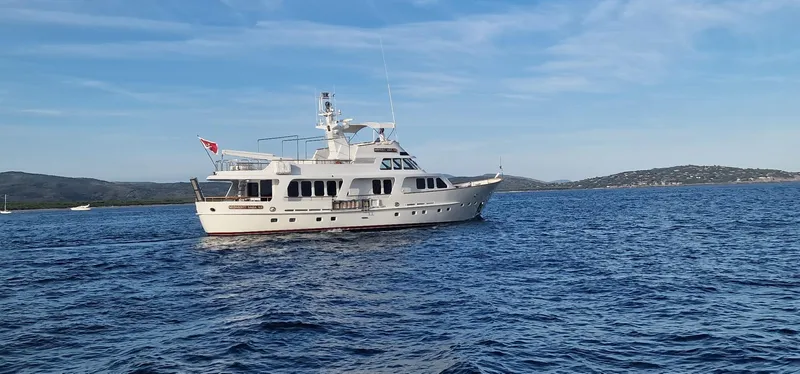  Yacht Photos Pics Moonen 85 yacht from 1989 cruising on a calm sea under a clear sky.