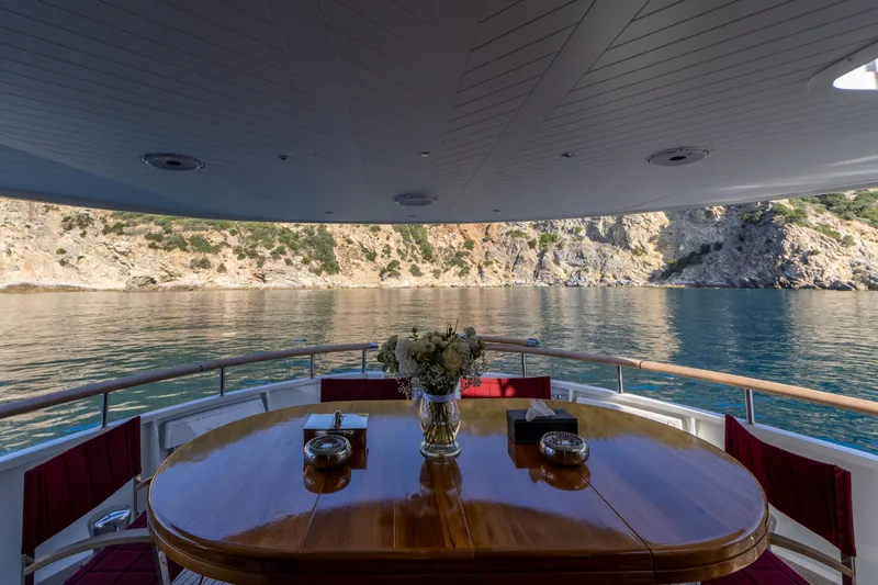  Yacht Photos Pics Luxurious dining area on 1989 Moonen 85 yacht with scenic ocean view.
