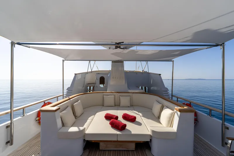  Yacht Photos Pics Luxurious 1989 Moonen 85 yacht deck with elegant seating and ocean view.