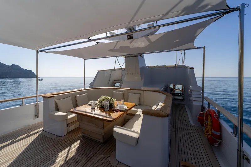  Yacht Photos Pics Luxurious 1989 Moonen 85 yacht deck with elegant seating and ocean view.