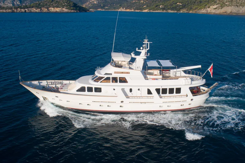  Yacht Photos Pics Luxury 1989 Moonen 85 yacht cruising on blue ocean waters.