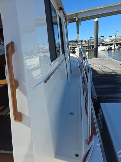 Juju Yacht Photos Pics 2004 Sabre 36 Flybridge Fast Trawler docked, showcasing side deck and marina view.