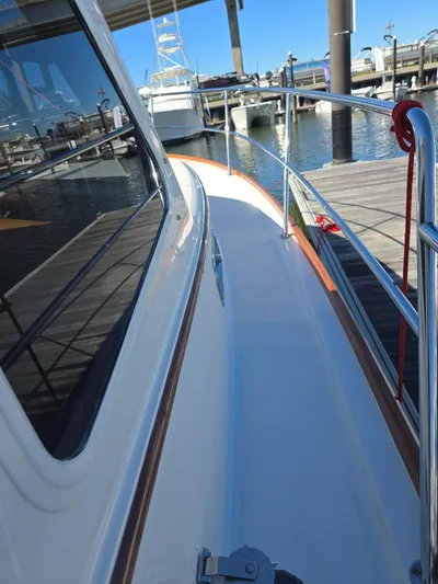 Juju Yacht Photos Pics 2004 Sabre 36 Flybridge Fast Trawler docked at marina, side deck view.