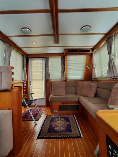 Juju Yacht Photos Pics Interior of 2004 Sabre 36 Flybridge Fast Trawler with cozy seating and elegant wood finish.
