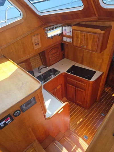 Juju Yacht Photos Pics 2004 Sabre 36 Flybridge Fast Trawler kitchen with wood cabinetry and modern appliances.