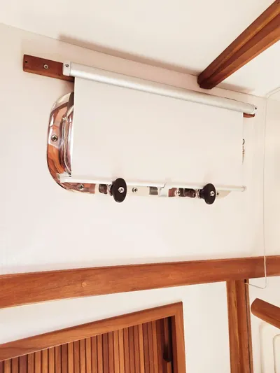 Juju Yacht Photos Pics Roller blind mechanism on 2004 Sabre 36 Flybridge Fast Trawler, featuring wooden accents.