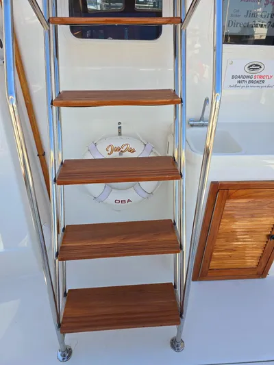 Juju Yacht Photos Pics Staircase on 2004 Sabre 36 Flybridge Fast Trawler with wooden steps and safety ring.