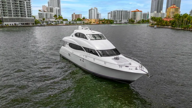 Fomo2 Yacht Photos Pics Luxury 2002 Lazzara 80 Skylounge yacht cruising in urban waterfront setting.