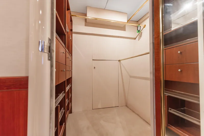Fomo2 Yacht Photos Pics Luxurious wooden closet interior on a 2002 Lazzara 80 Skylounge yacht.