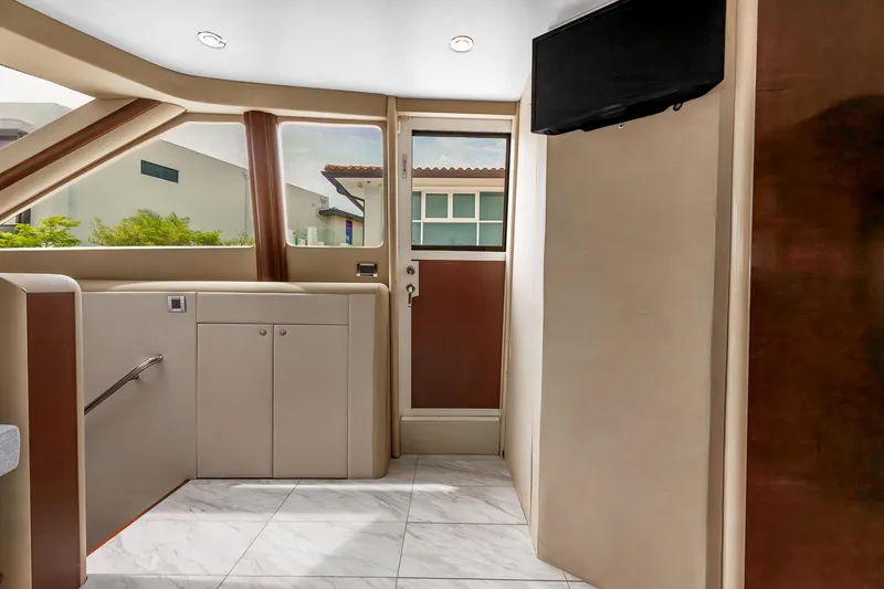 Fomo2 Yacht Photos Pics Interior of 2002 Lazzara 80 Skylounge yacht with modern design and large windows.