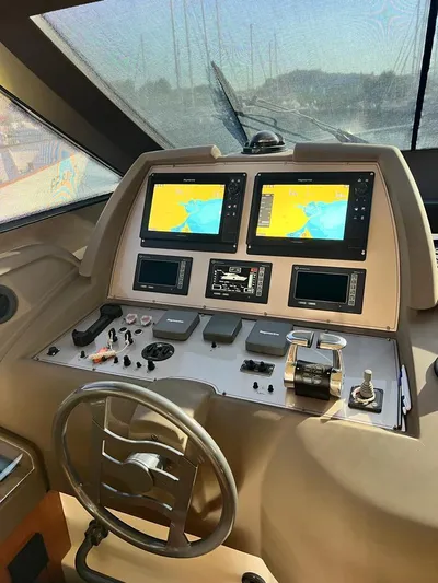  Yacht Photos Pics Control panel of a 2008 Ferretti Yachts 592 with dual navigation screens.