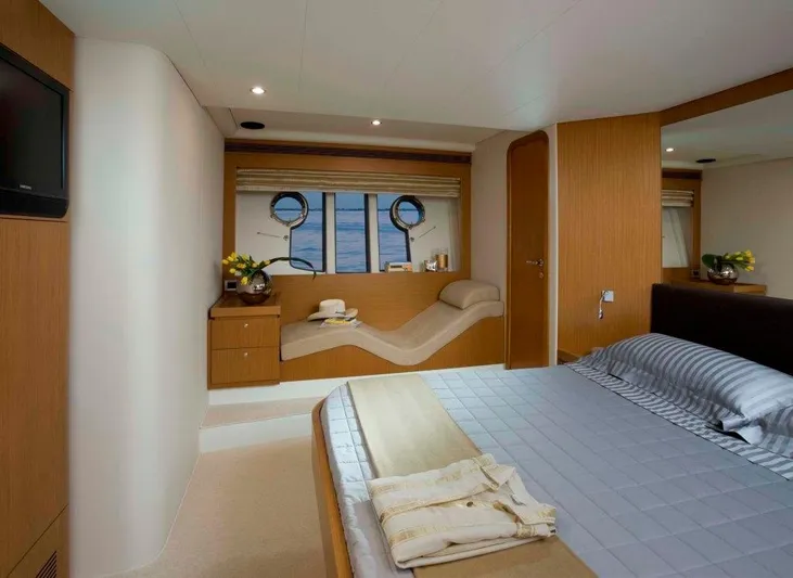  Yacht Photos Pics Luxurious bedroom interior of 2008 Ferretti Yachts 592 with ocean view and modern decor.