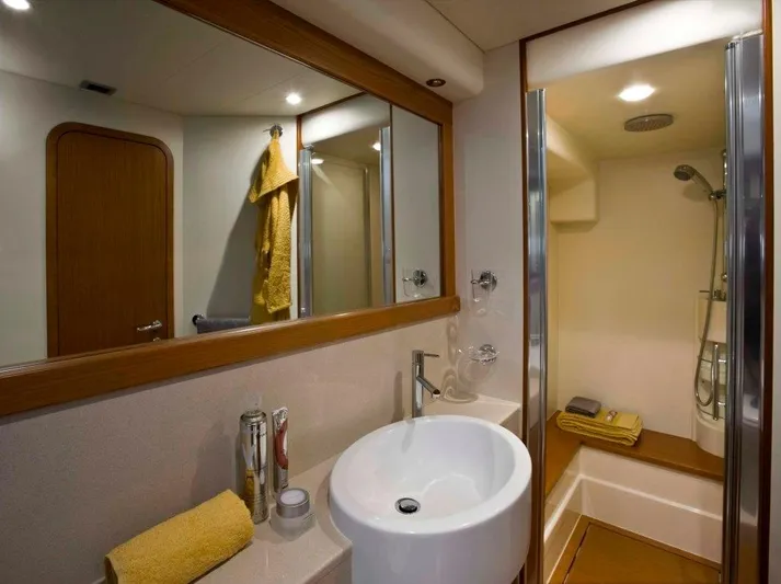  Yacht Photos Pics Luxurious bathroom in 2008 Ferretti Yachts 592, featuring modern fixtures and elegant design.
