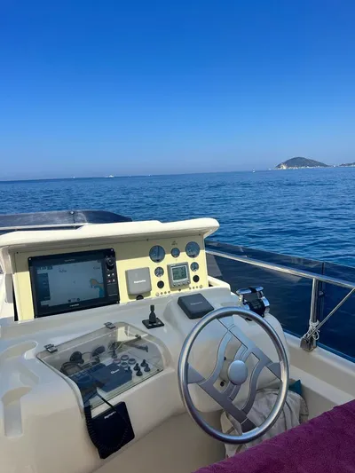  Yacht Photos Pics 2008 Ferretti Yachts 592 helm with ocean view and clear blue sky.