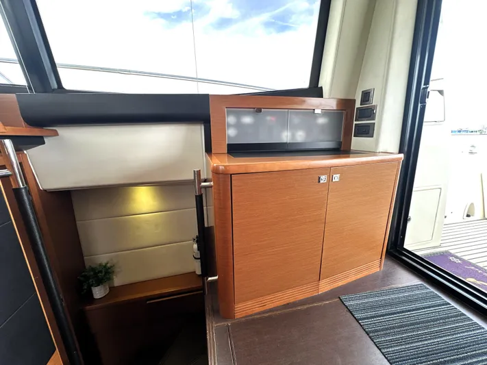  Yacht Photos Pics Luxurious interior of 2013 Prestige 500 yacht with wooden cabinetry and modern design.