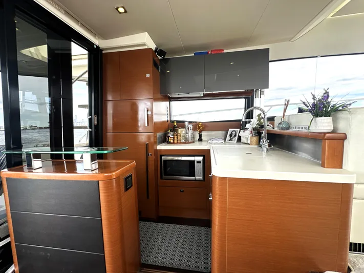  Yacht Photos Pics Luxurious kitchen interior of a 2013 Prestige 500 yacht with modern amenities.