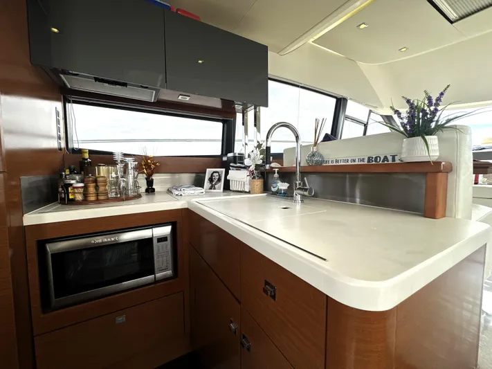  Yacht Photos Pics Luxurious kitchen interior on a 2013 Prestige 500 yacht, featuring modern appliances and sleek design.