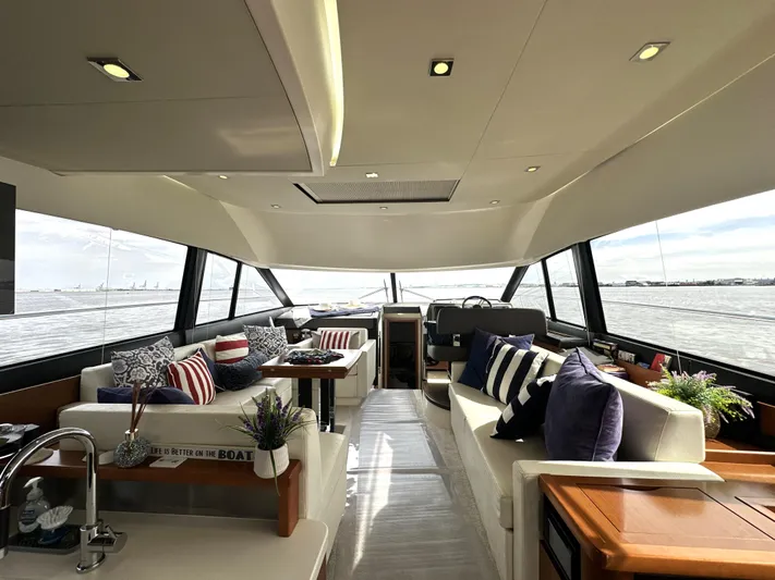  Yacht Photos Pics Luxurious interior of a 2013 Prestige 500 yacht with elegant seating and panoramic windows.