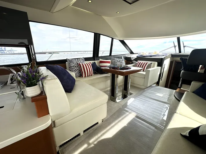  Yacht Photos Pics Luxurious interior of a 2013 Prestige 500 yacht with elegant seating and nautical decor.