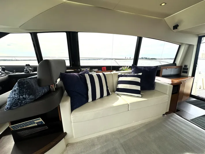  Yacht Photos Pics Luxurious interior of a 2013 Prestige 500 yacht with stylish seating and striped cushions.