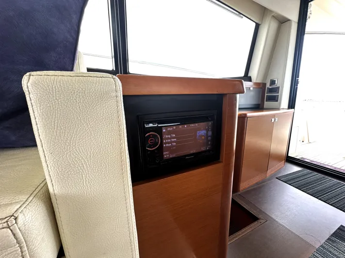  Yacht Photos Pics Interior of 2013 Prestige 500 yacht with modern control panel and wooden cabinetry.