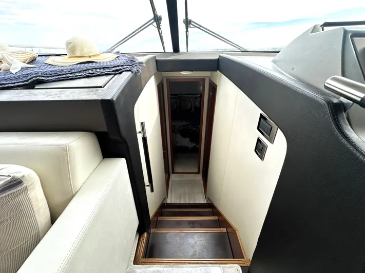  Yacht Photos Pics Interior view of a 2013 Prestige 500 yacht, featuring a staircase and modern design.