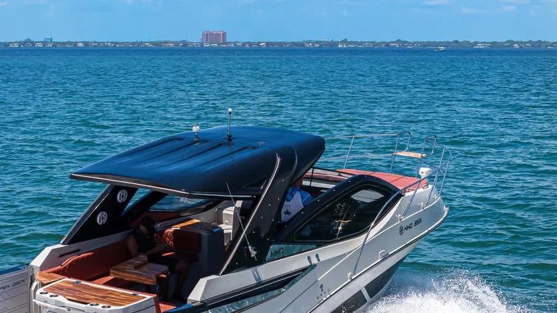  Yacht Photos Pics 2024 NHD 355 Open Deck yacht cruising on blue ocean waters.