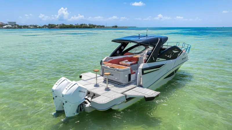  Yacht Photos Pics 2024 NHD 355 Open Deck boat on clear turquoise water.