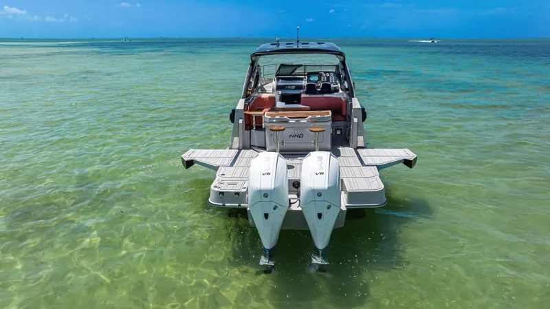 Yacht Photos Pics 2024 NHD 355 Open Deck boat on clear turquoise water.