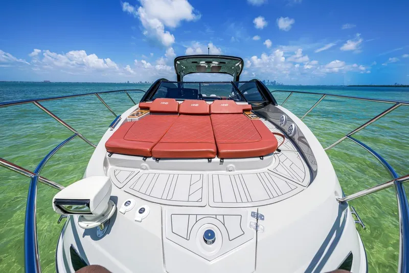 Yacht Photos Pics 2024 NHD 355 Open Deck yacht on clear turquoise water under blue sky.