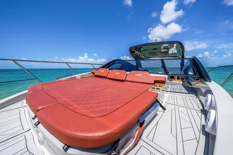  Yacht Photos Pics 2024 NHD 355 Open Deck yacht with luxurious sunbed on a sunny ocean day.