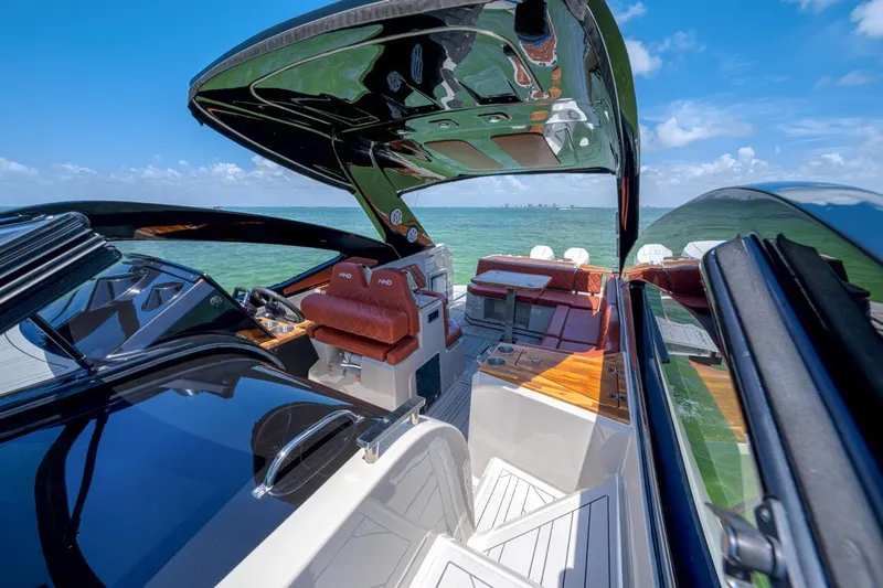  Yacht Photos Pics 2024 NHD 355 Open Deck boat interior with luxurious seating and open canopy.