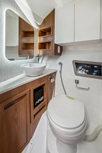  Yacht Photos Pics 2024 NHD 355 Open Deck bathroom with modern fixtures and wooden cabinetry.