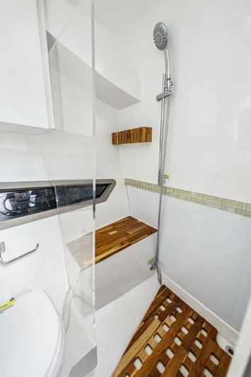  Yacht Photos Pics 2024 NHD 355 Open Deck bathroom with modern shower and wooden accents.