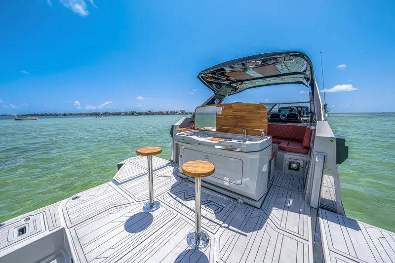  Yacht Photos Pics 2024 NHD 355 Open Deck boat with modern seating and ocean view.