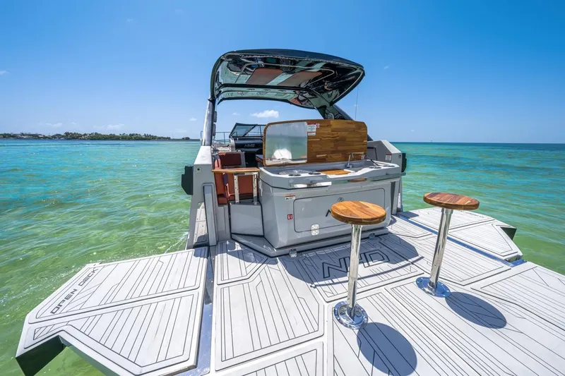  Yacht Photos Pics 2024 NHD 355 Open Deck boat on clear turquoise water.