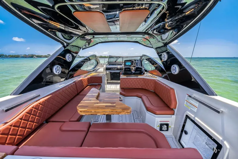  Yacht Photos Pics Luxurious 2024 NHD 355 Open Deck boat interior with leather seating and ocean view.