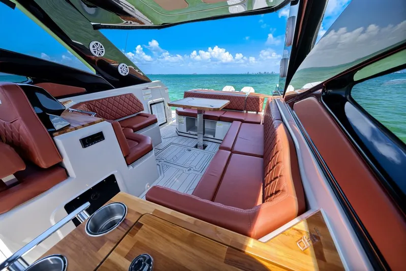  Yacht Photos Pics Luxurious 2024 NHD 355 Open Deck yacht interior with leather seating and ocean view.