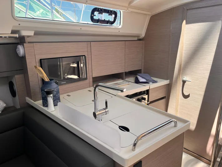 Sfo 418 #289 In Stock Yacht Photos Pics Modern kitchen area in 2023 Hanse 418 yacht with sleek cabinetry and sink.