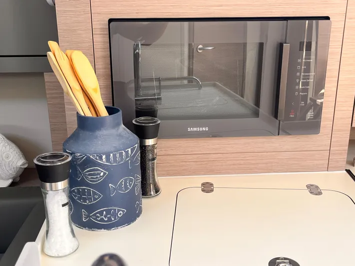 Sfo 418 #289 In Stock Yacht Photos Pics Modern kitchen in 2023 Hanse 418 yacht with Samsung microwave and utensil holder.