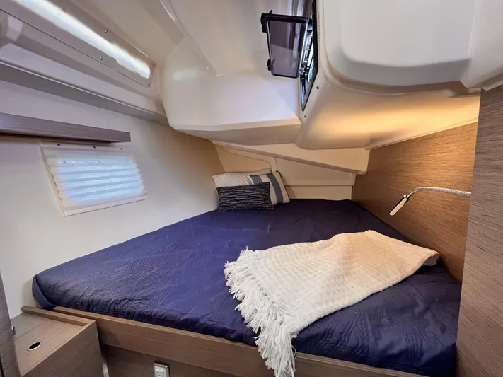 Sfo 418 #289 In Stock Yacht Photos Pics Cozy bedroom in 2023 Hanse 418 yacht with blue bedding and soft lighting.