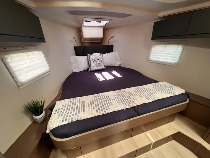Sfo 418 #289 In Stock Yacht Photos Pics 2023 Hanse 418 yacht interior cabin with bed, pillows, and natural light.